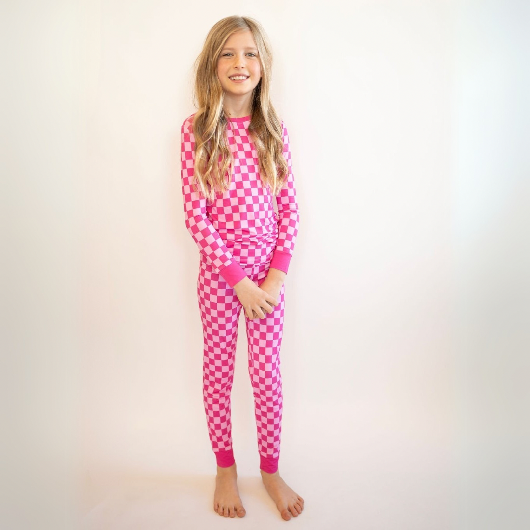 kids wearing pink checker bamboo matching pajamas